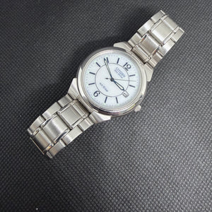 Citizen Eco-Drive Solar (Mid-2000s) – Arctic White & Royal Blue Dial
